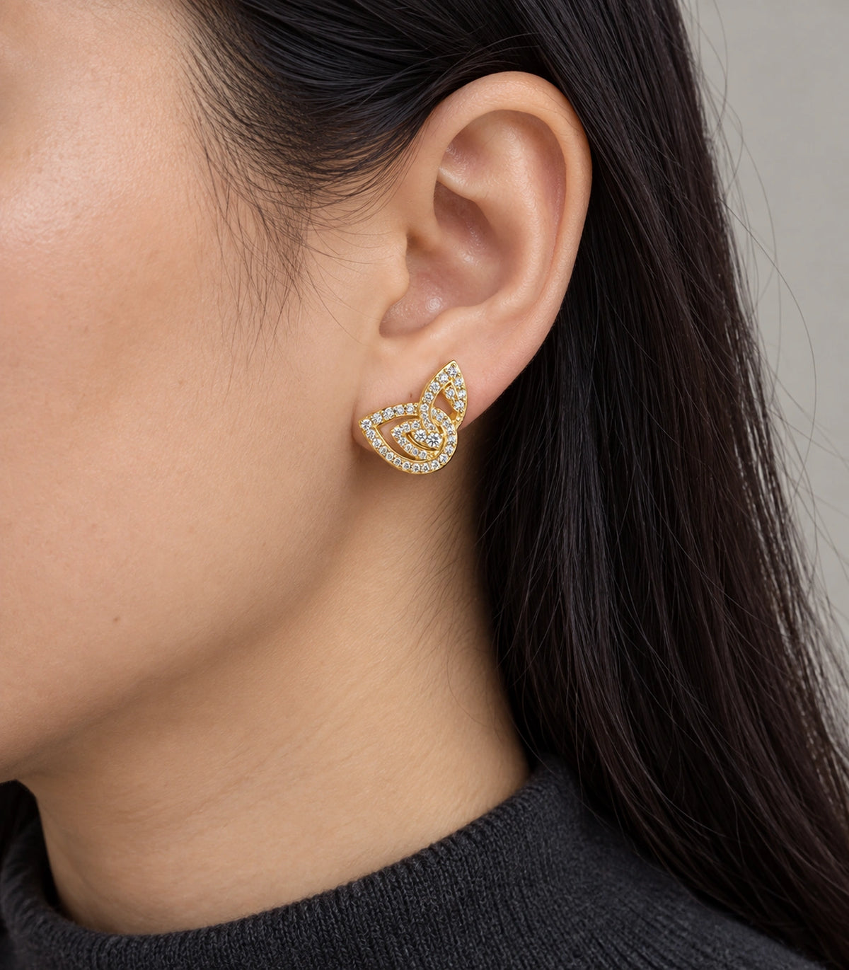 JIMIKI Crystal Open Swirl Stud Earring Pair in Gold tone, model wearing view #color_gold tone