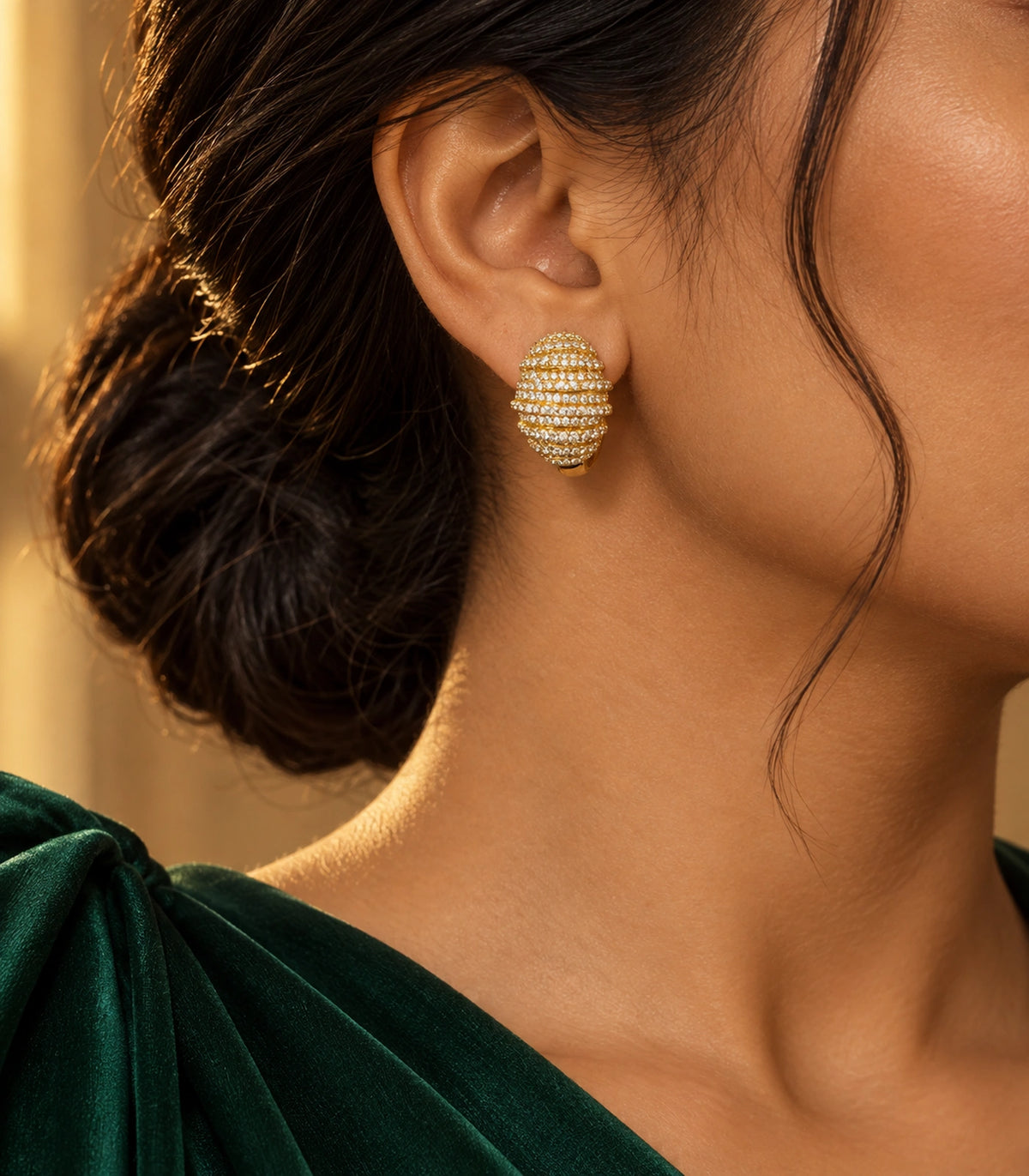 JIMIKI Crystal Ribbed Dome Huggie Earrings in Gold / Clear, editorial model view #color_gold / clear