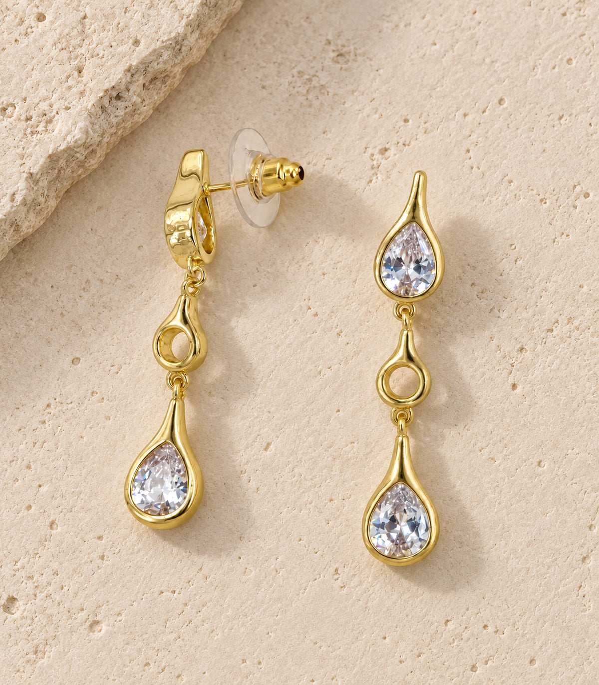 JIMIKI Crystal Teardrop Open Link Drop Earring Pair in Gold tone, editorial flat lay #color_gold tone