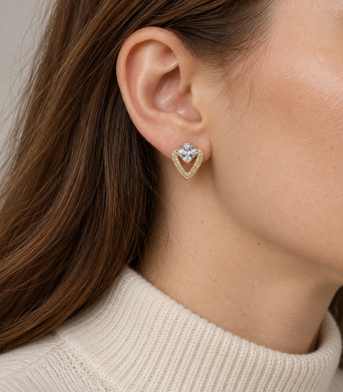 JIMIKI Gold Tone Cushion Crystal V Frame Stud Earring Pair in Gold-tone, model wearing view