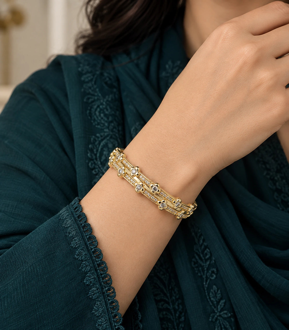 JIMIKI Gold-Tone Double Rail Bezel Crystal Bangle — bangle styled with an outfit #color_gold-tone / clear