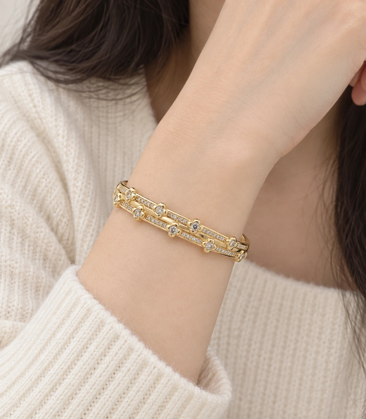 JIMIKI Gold-Tone Double Rail Bezel Crystal Bangle — worn on the wrist #color_gold-tone / clear