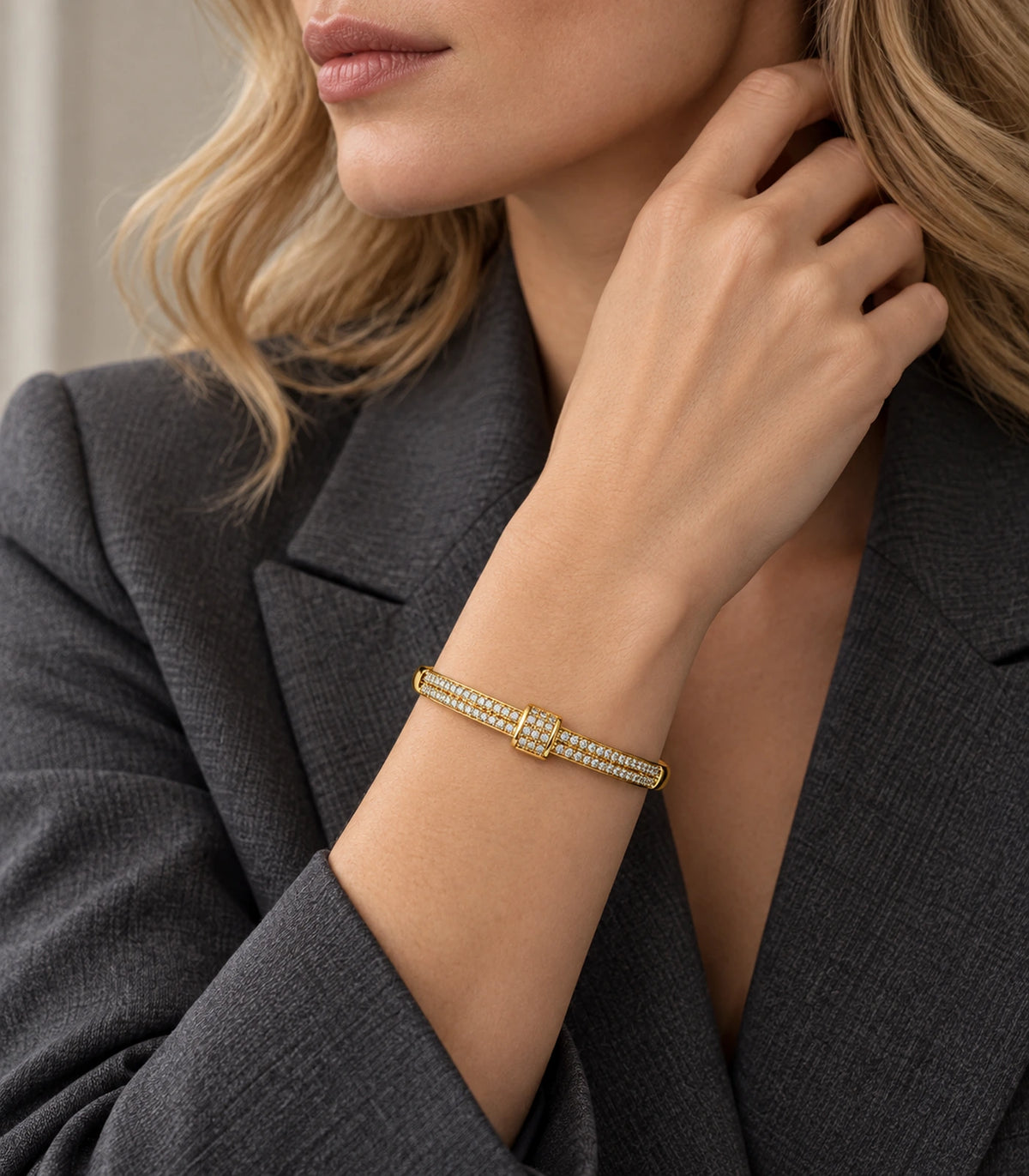 JIMIKI Gold-Tone Double Row Pavé Buckle Bangle — bangle styled with an outfit #color_gold-tone / clear