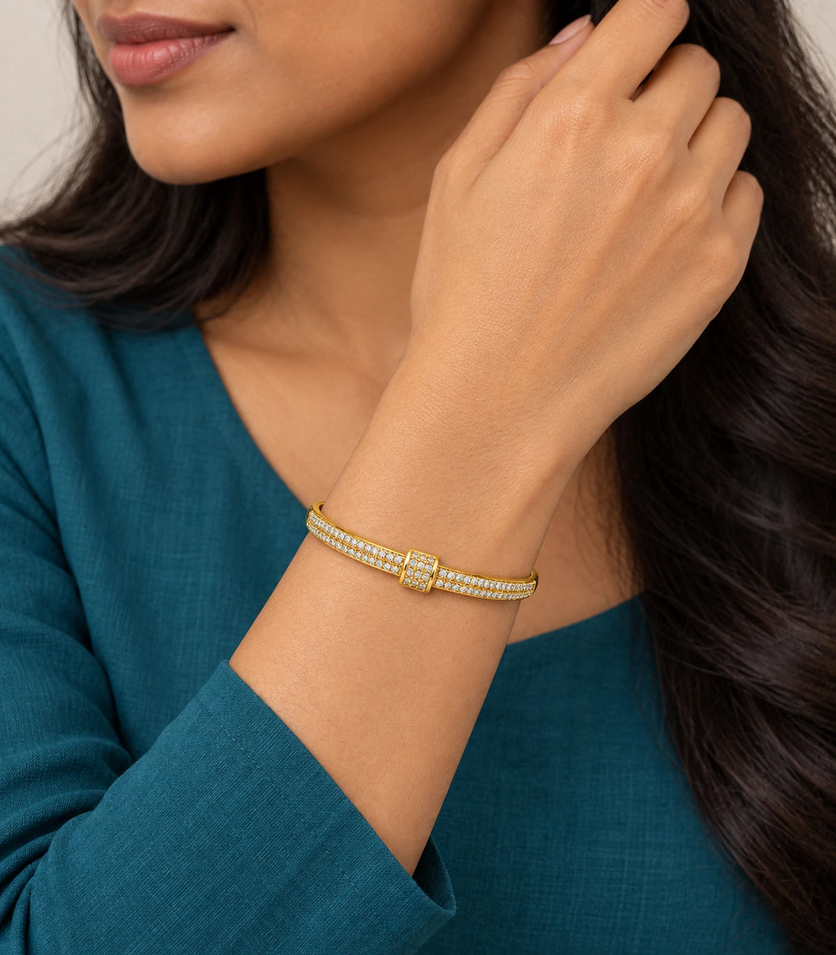 JIMIKI Gold-Tone Double Row Pavé Buckle Bangle — worn on the wrist #color_gold-tone / clear