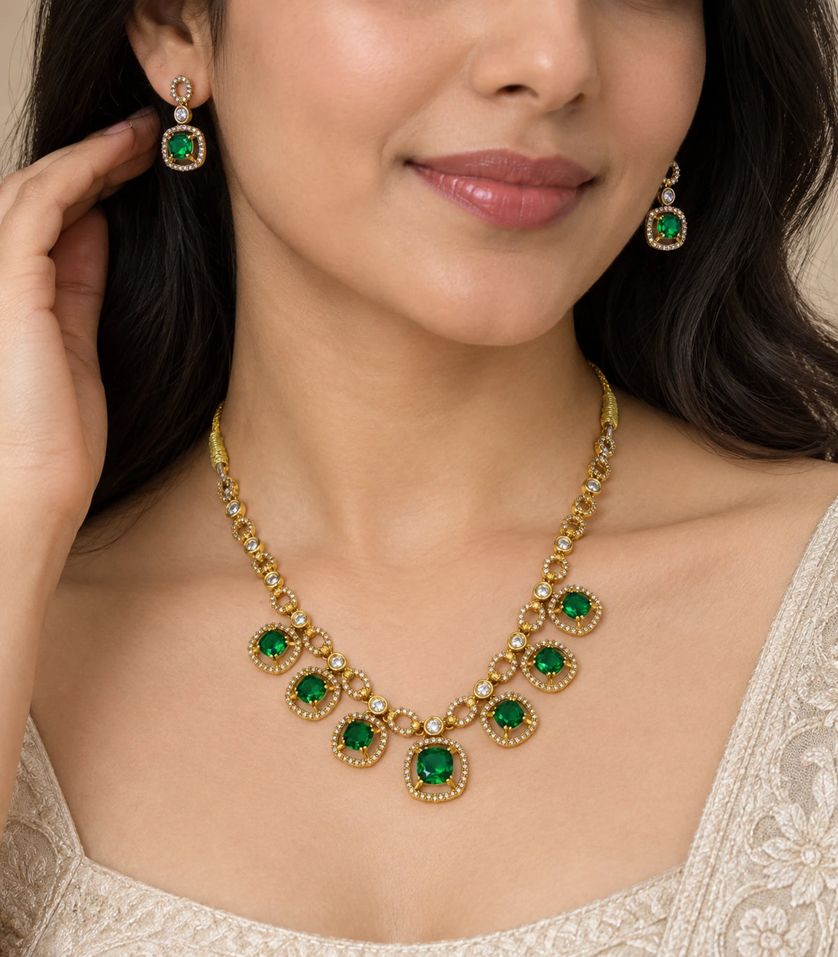Round Crystal Teardrop Necklace Set in Emerald with gold-tone finish, closeup worn view #Color_Emerald