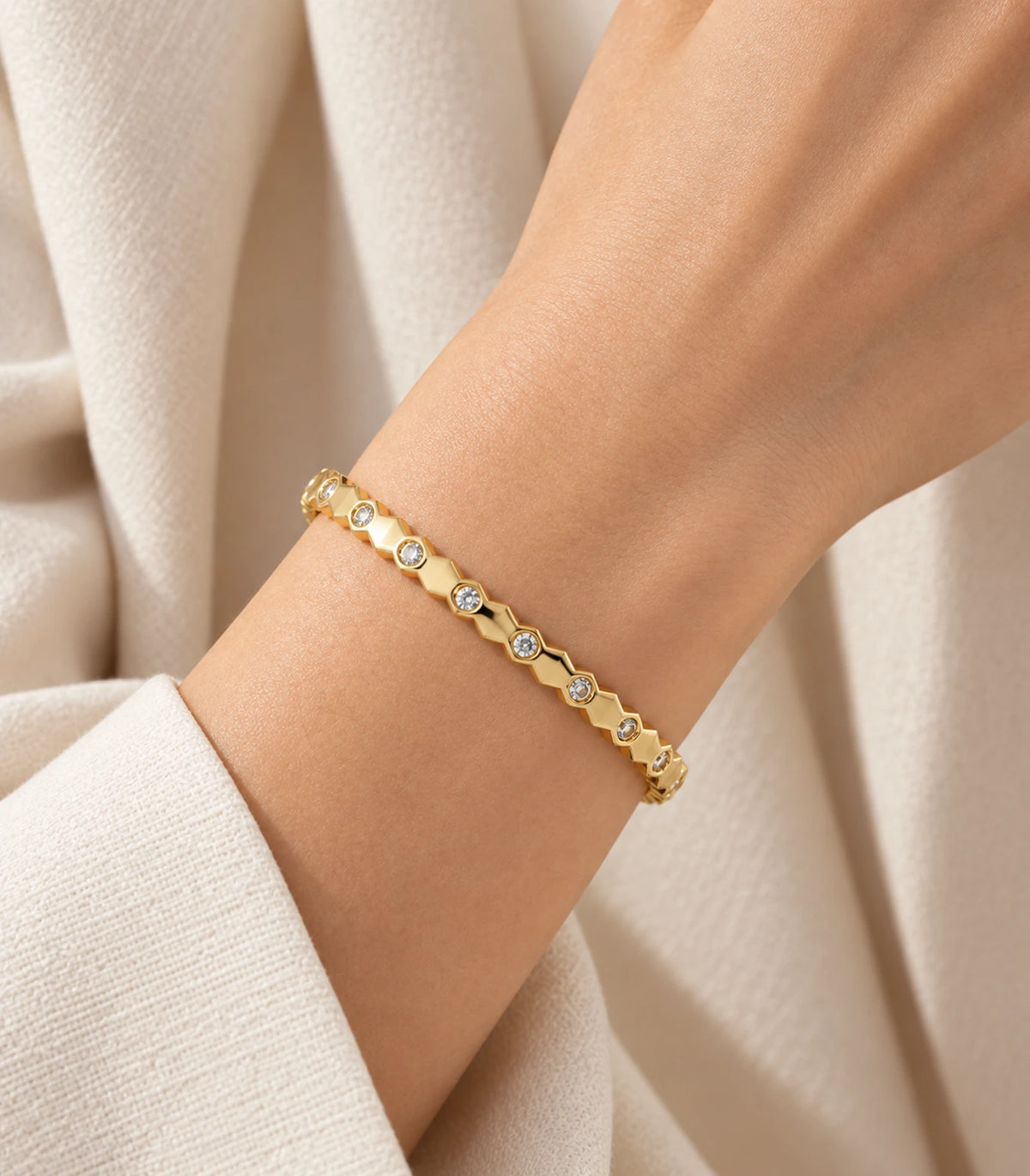 JIMIKI Gold-Tone Faceted Bezel Crystal Bangle — bangle styled with an outfit #color_gold-tone / clear