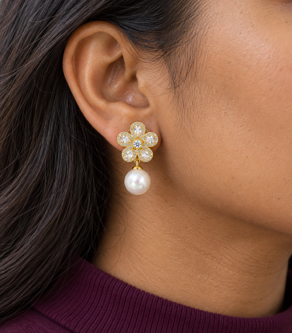 JIMIKI Five Petal Crystal Flower Pearl Drop Earring Pair in Gold-tone, close-up detail #color_gold-tone