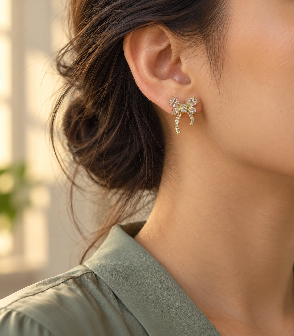 JIMIKI Four Pear Crystal Bow Stud Earring Pair in Gold Tone, editorial model view #color_gold tone