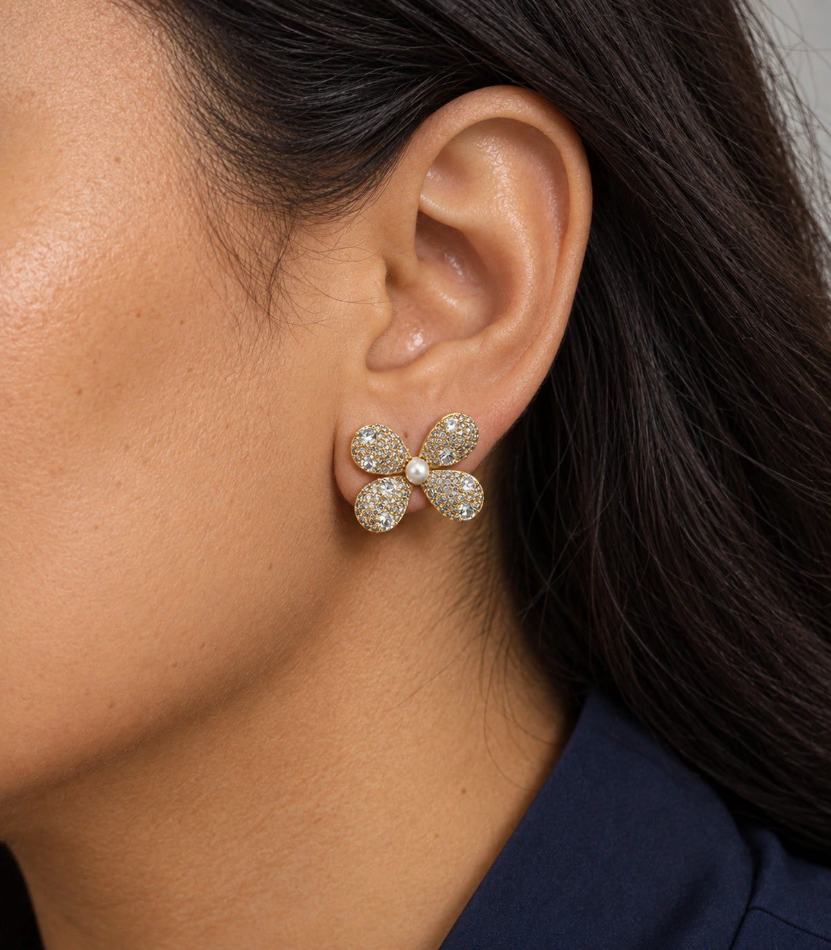 JIMIKI Four Petal Pave Pearl Centre Stud Earring Pair in Gold tone, close-up detail #color_gold tone