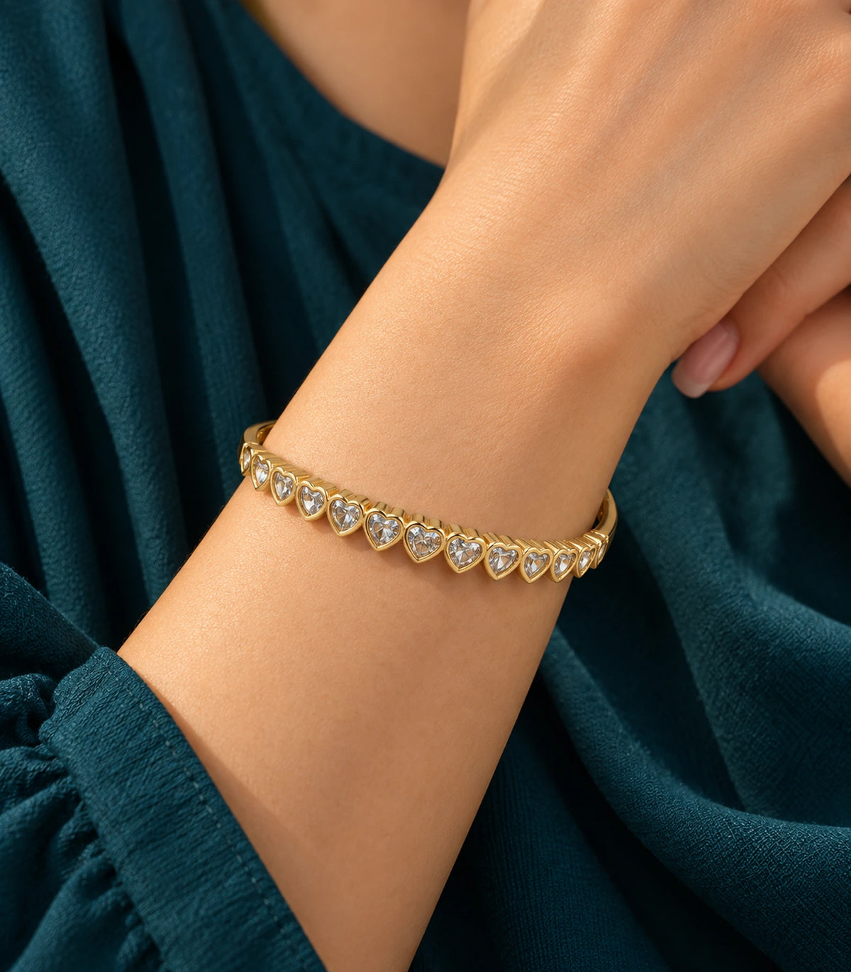 JIMIKI Gold-Tone Graduated Heart Crystal Bangle — bangle styled with an outfit #color_gold-tone / clear
