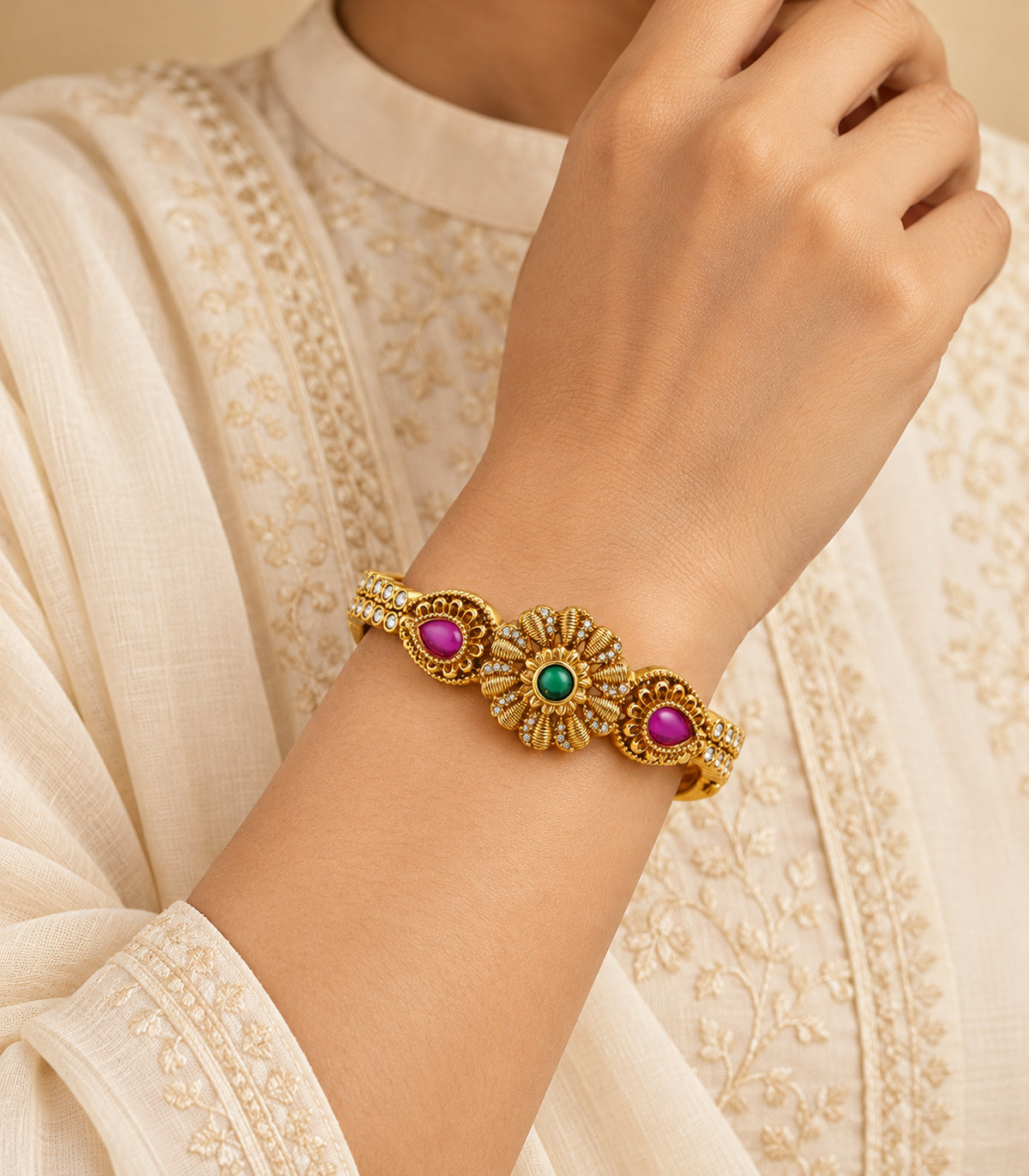 Gold-tone green flower and magenta teardrop single bangle — editorial model view
