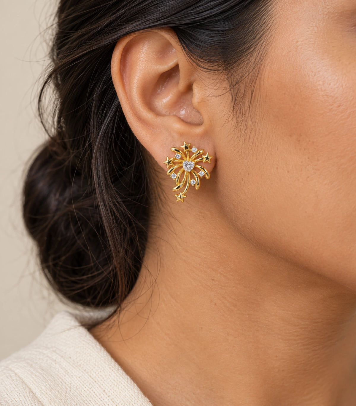 JIMIKI Heart Crystal Starburst Stud Earring Pair in Gold tone/Clear, model wearing view #color_gold tone/clear