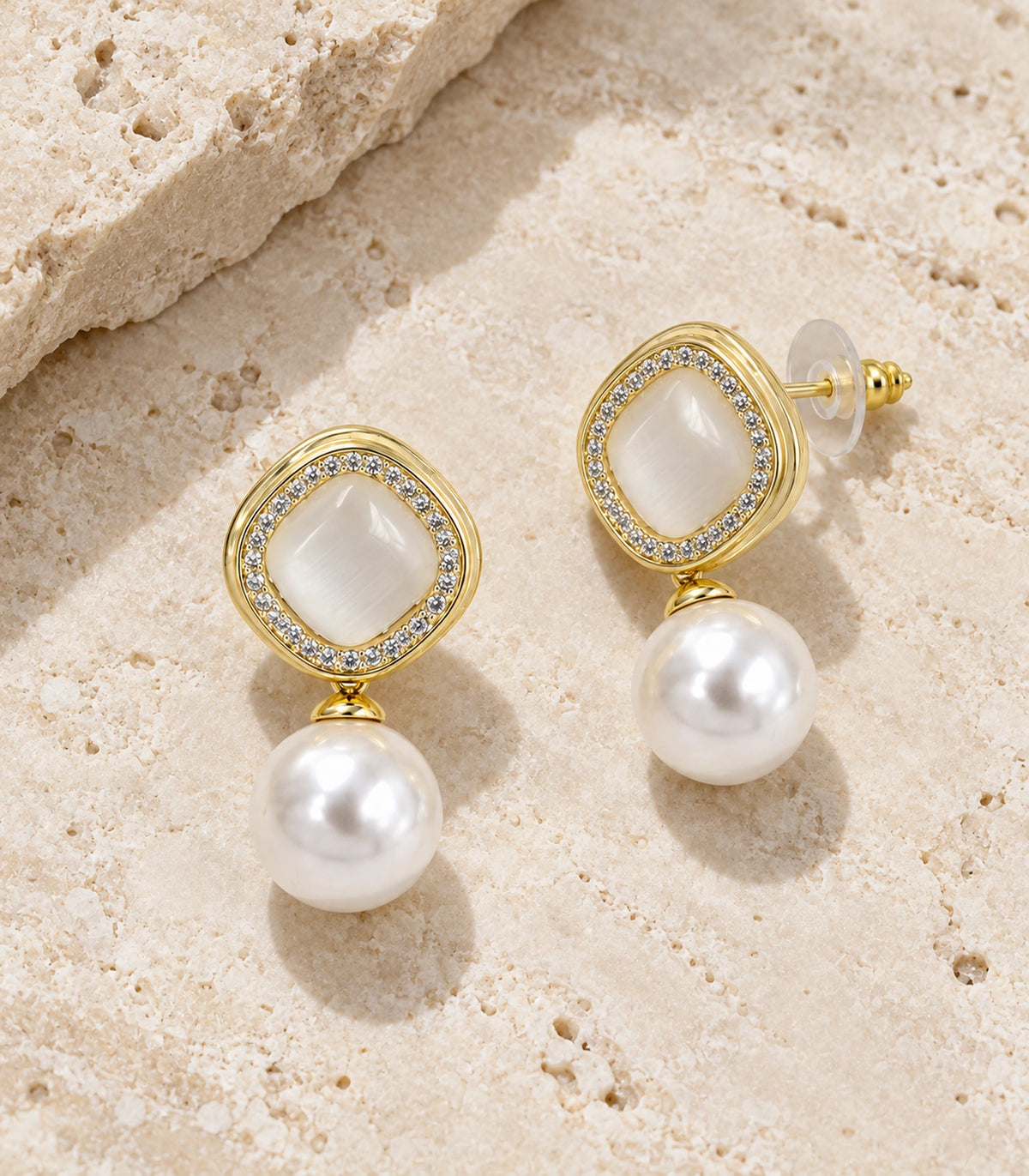 JIMIKI Crystal Halo Pearl Drop Earring Pair in Gold-tone / Ivory, editorial flat lay #color_gold-tone / ivory