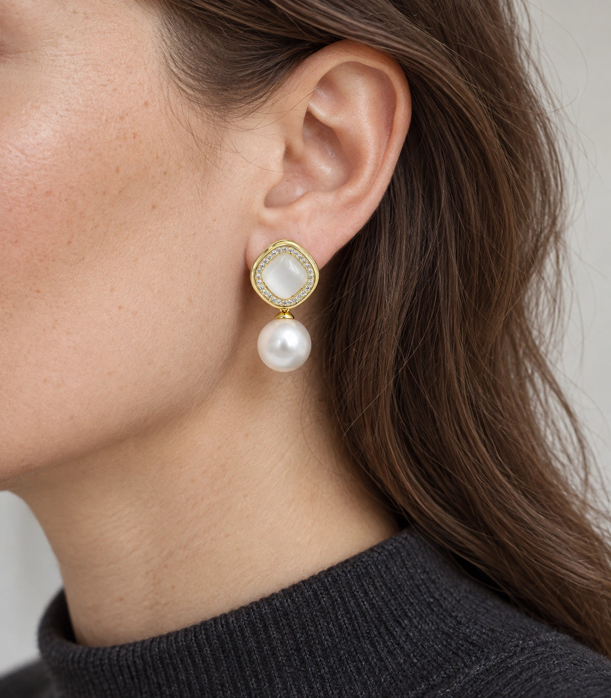 JIMIKI Crystal Halo Pearl Drop Earring Pair in Gold-tone / Ivory, model wearing view #color_gold-tone / ivory