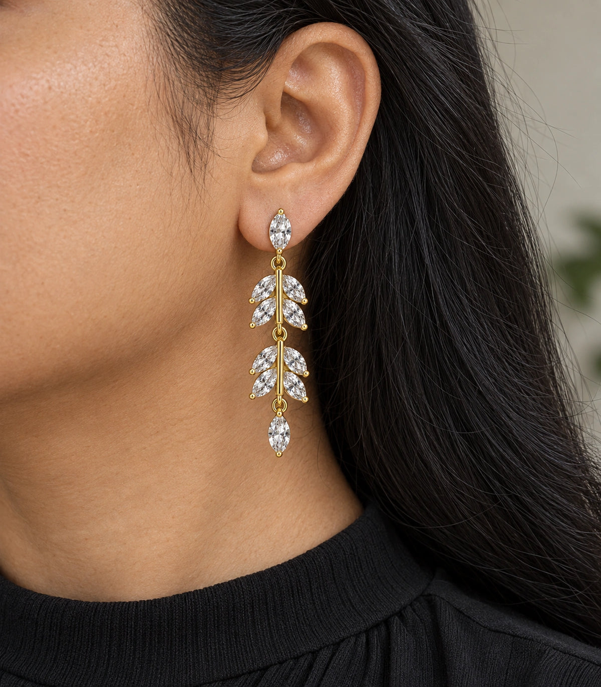 JIMIKI Marquise Crystal Leaf Drop Earring Pair in Gold tone, model wearing view #color_gold tone