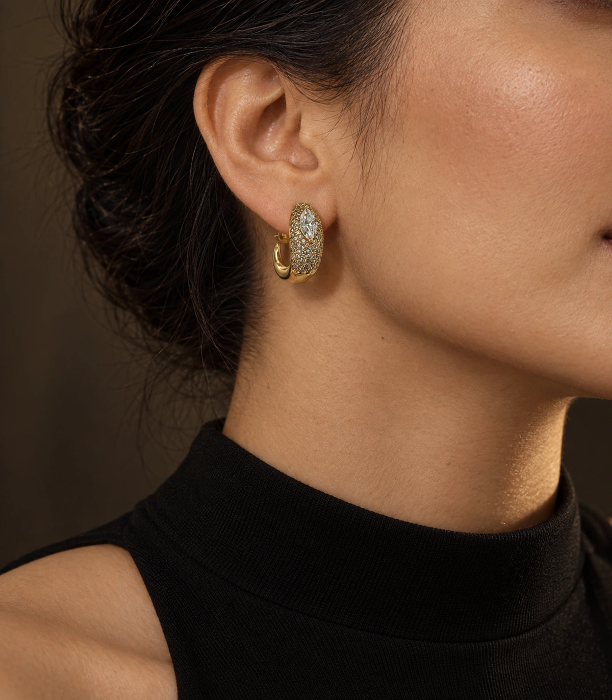 JIMIKI marquise pave open hoop earring pair in gold tone in an editorial model view #color_gold tone