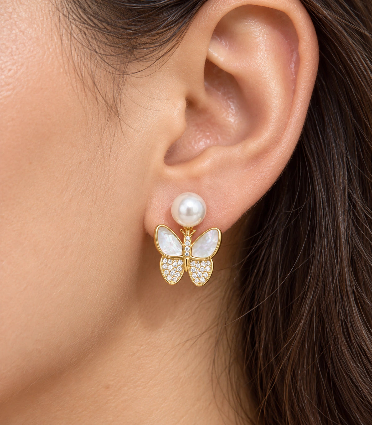 JIMIKI Gold-Tone Pearlescent Butterfly Pearl-Style Stud Earrings in Pearl White / Gold, close-up detail
