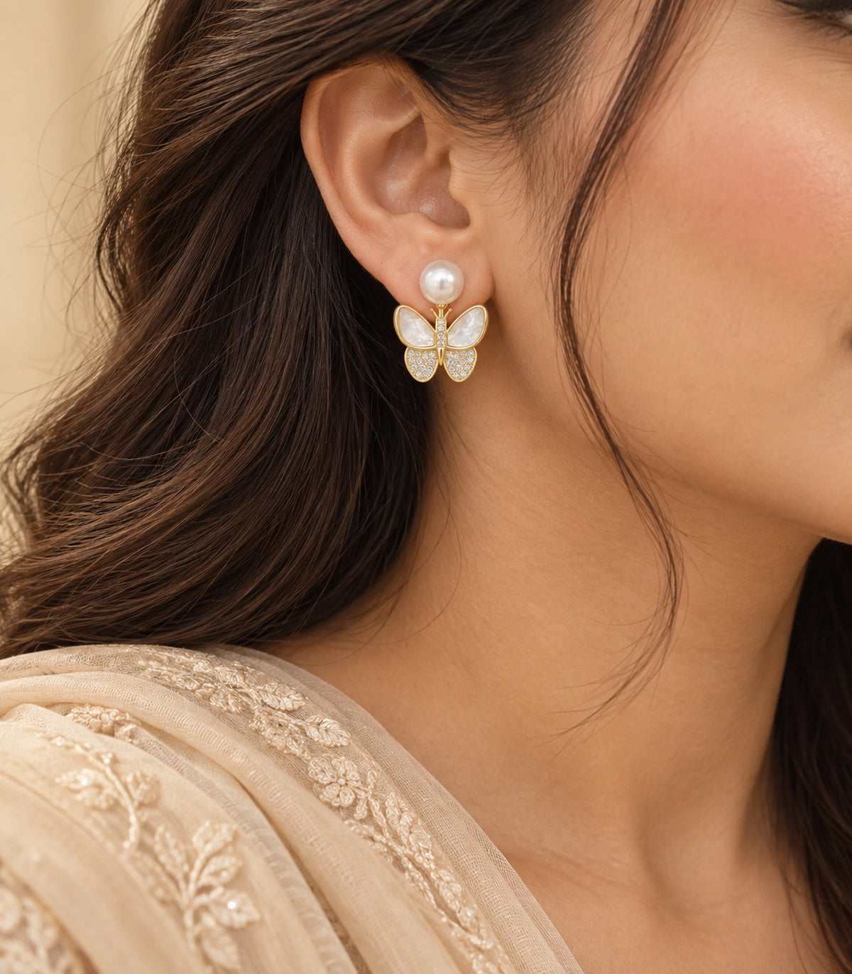 JIMIKI Gold-Tone Pearlescent Butterfly Pearl-Style Stud Earrings in Pearl White / Gold, editorial model view