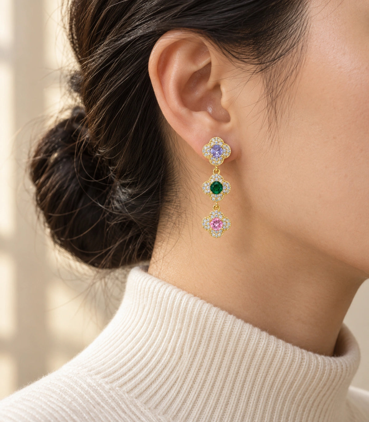 JIMIKI Gold Tone Multicolour Triple Clover Halo Drop Earring Pair in Gold tone / multicolour, editorial model view