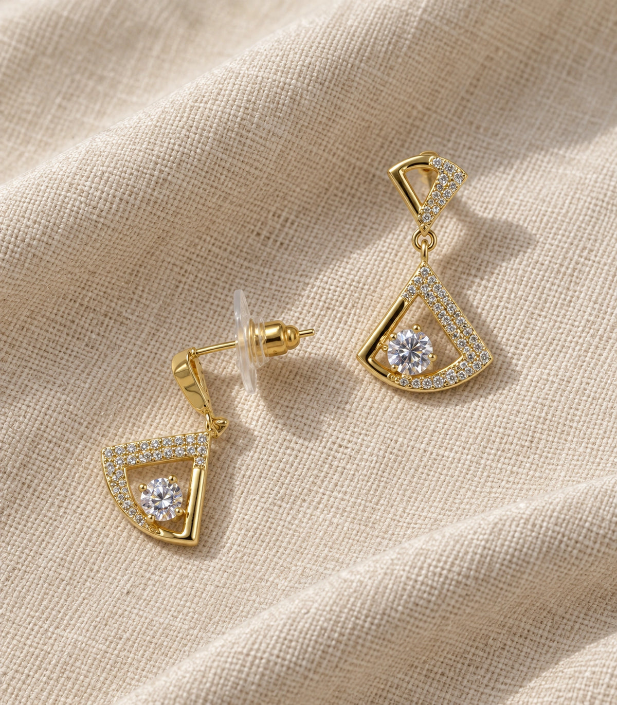 JIMIKI Open Fan Crystal Drop Earring Pair in Gold Tone, editorial flat lay #color_gold tone