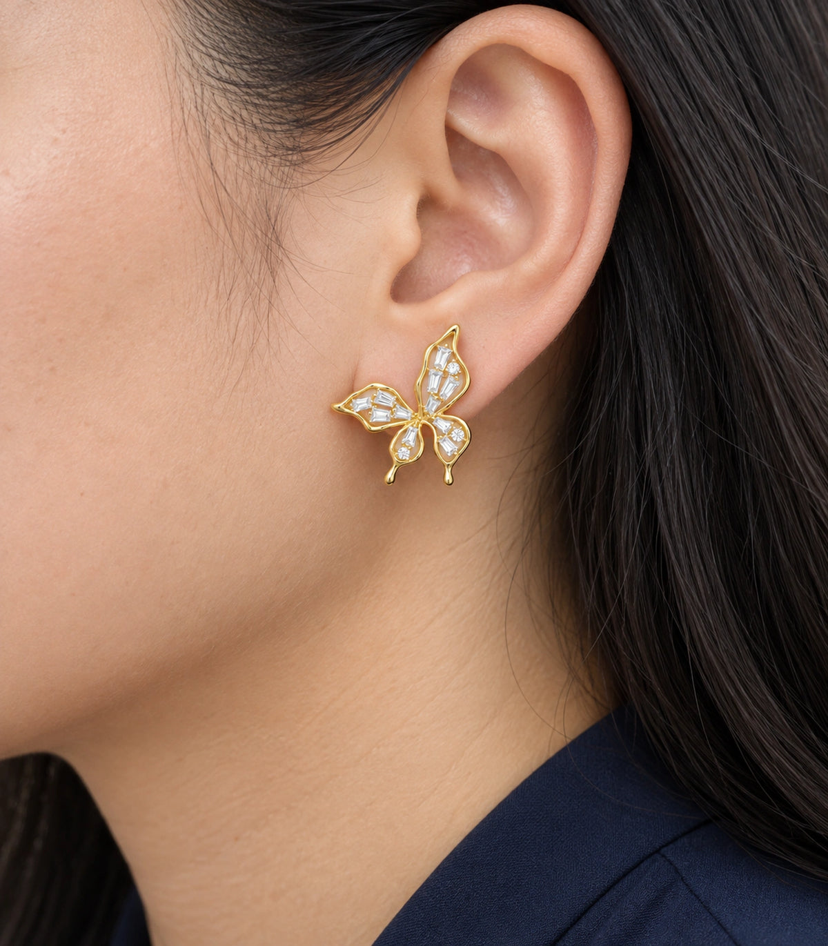 JIMIKI Openwork Baguette Crystal Butterfly Stud Earring Pair in Gold-tone, close-up detail #color_gold-tone