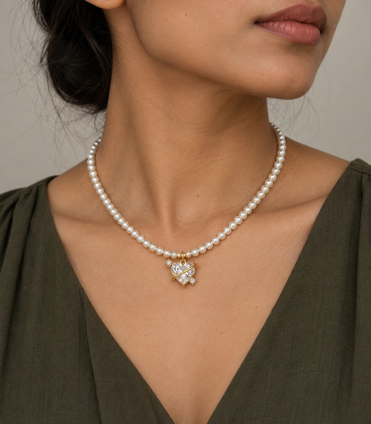 JIMIKI Gold Tone Orbit Heart Crystal Pearl Style Necklace in Gold tone / white, editorial model view