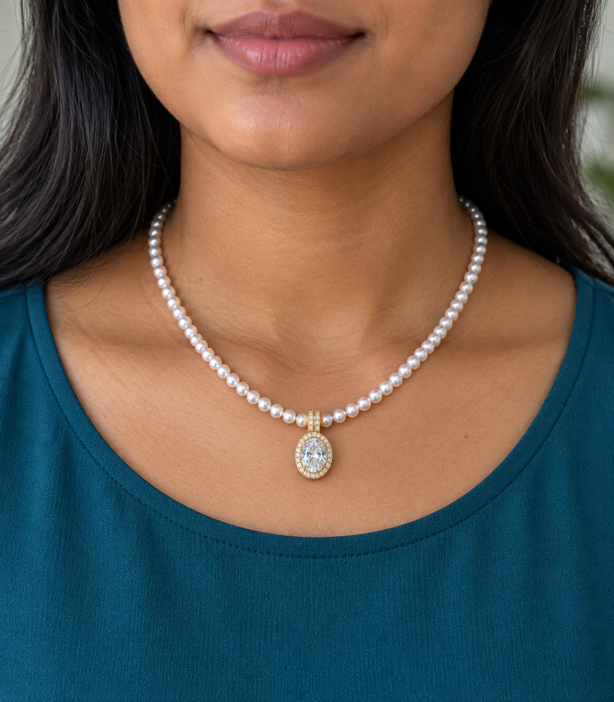 JIMIKI Gold Tone Oval Halo Crystal Pearl Style Necklace in Gold / White, model wearing view