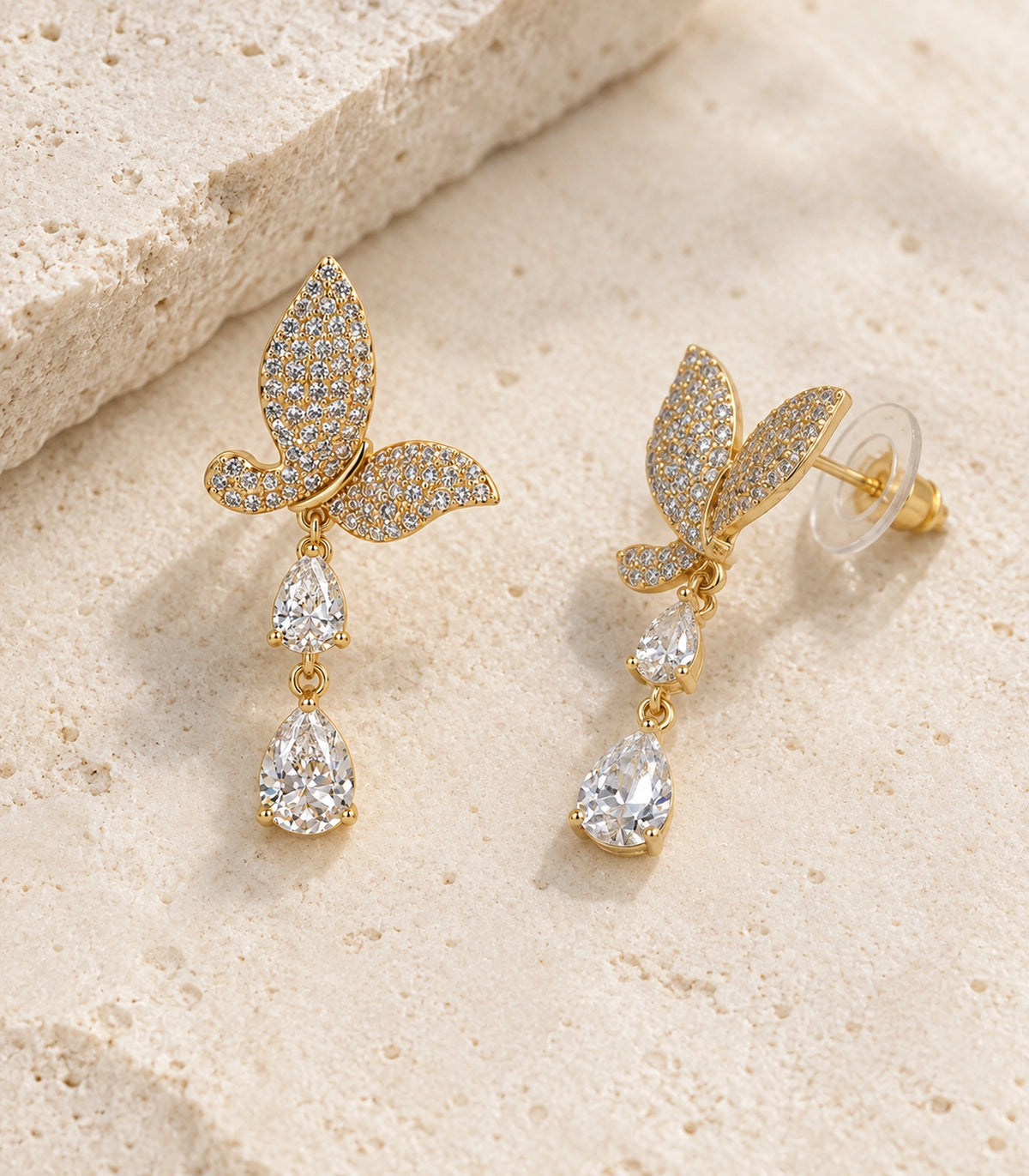 JIMIKI Pave Butterfly Double Teardrop Earring Pair in Gold-tone, editorial flat lay #color_gold-tone