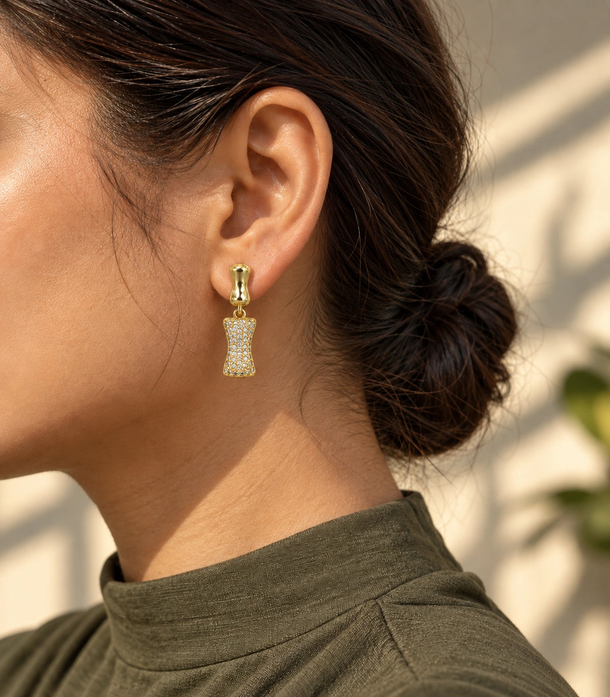 JIMIKI Pave Hourglass Drop Earring Pair in Gold tone, editorial model view #color_gold tone