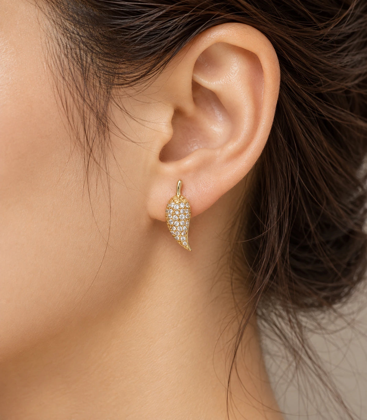 JIMIKI Gold Tone Pave Leaf Stud Earrings - editorial-model #color_gold-tone