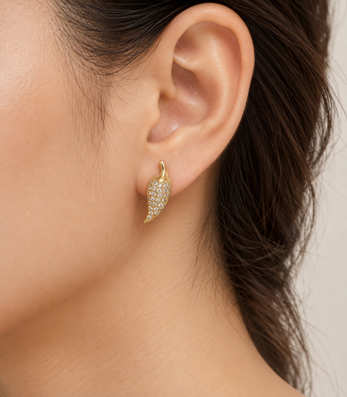 JIMIKI Gold Tone Pave Leaf Stud Earrings - model #color_gold-tone