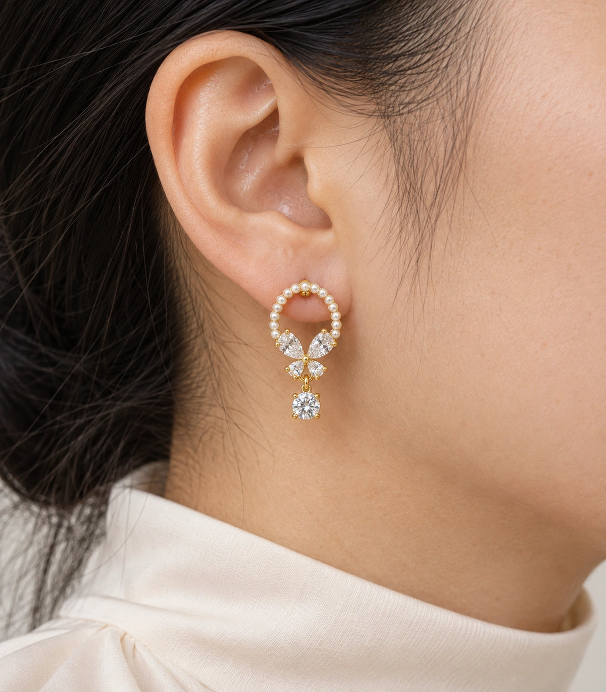 JIMIKI Gold Tone Pearl Loop Crystal Butterfly Drop Earring Pair in Gold-tone, close-up detail