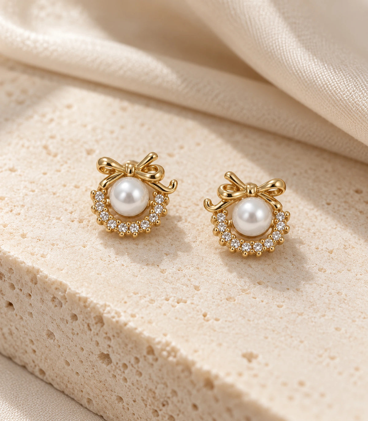 JIMIKI Gold Tone Pearl Wreath Bow Stud Earrings - editorial-flatlay #color_gold-tone