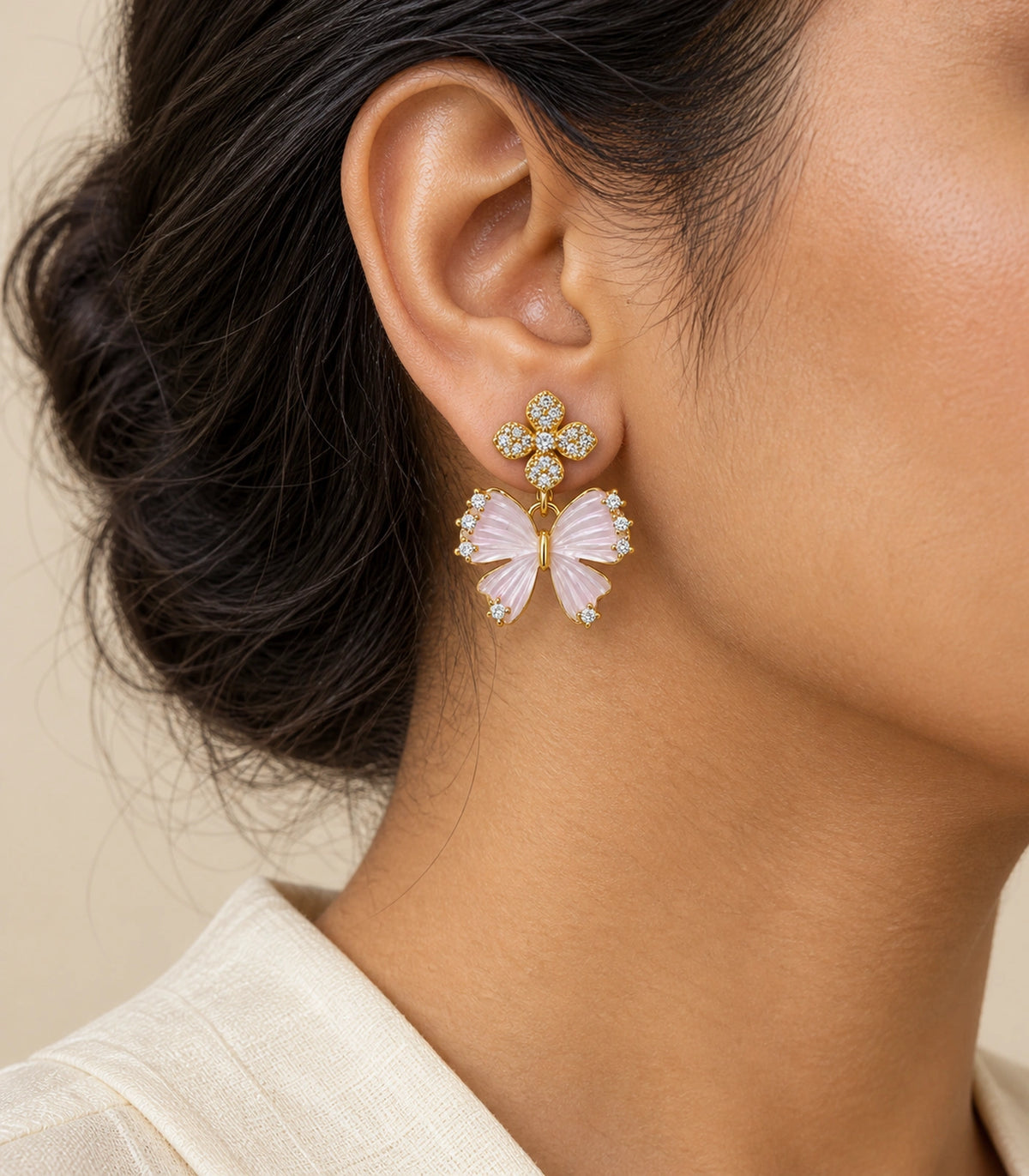 JIMIKI Butterfly Crystal Flower Drop Earring Pair in Gold tone/Pink, model wearing view #color_gold tone/pink