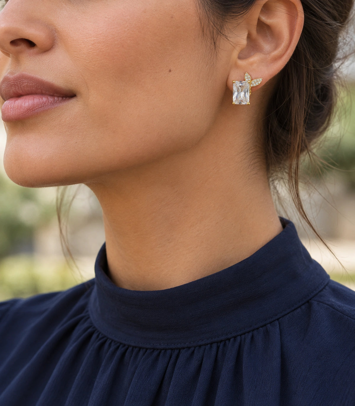 JIMIKI Rectangular Crystal Twin Leaf Stud Earring Pair in Gold-tone, editorial model view #color_gold-tone