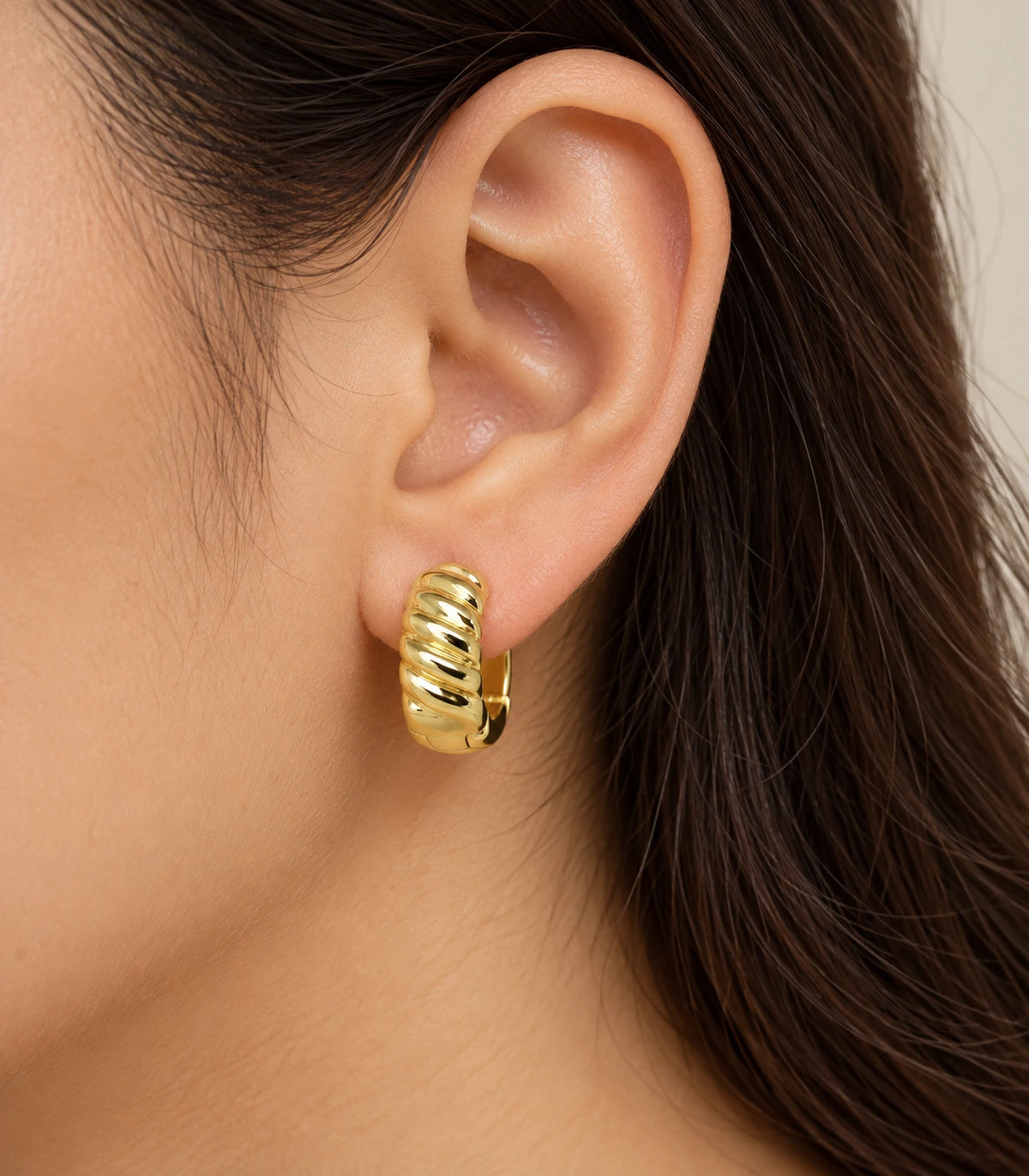 JIMIKI Gold Tone Ribbed Hoop Earrings in Gold Tone - model #color_gold-tone