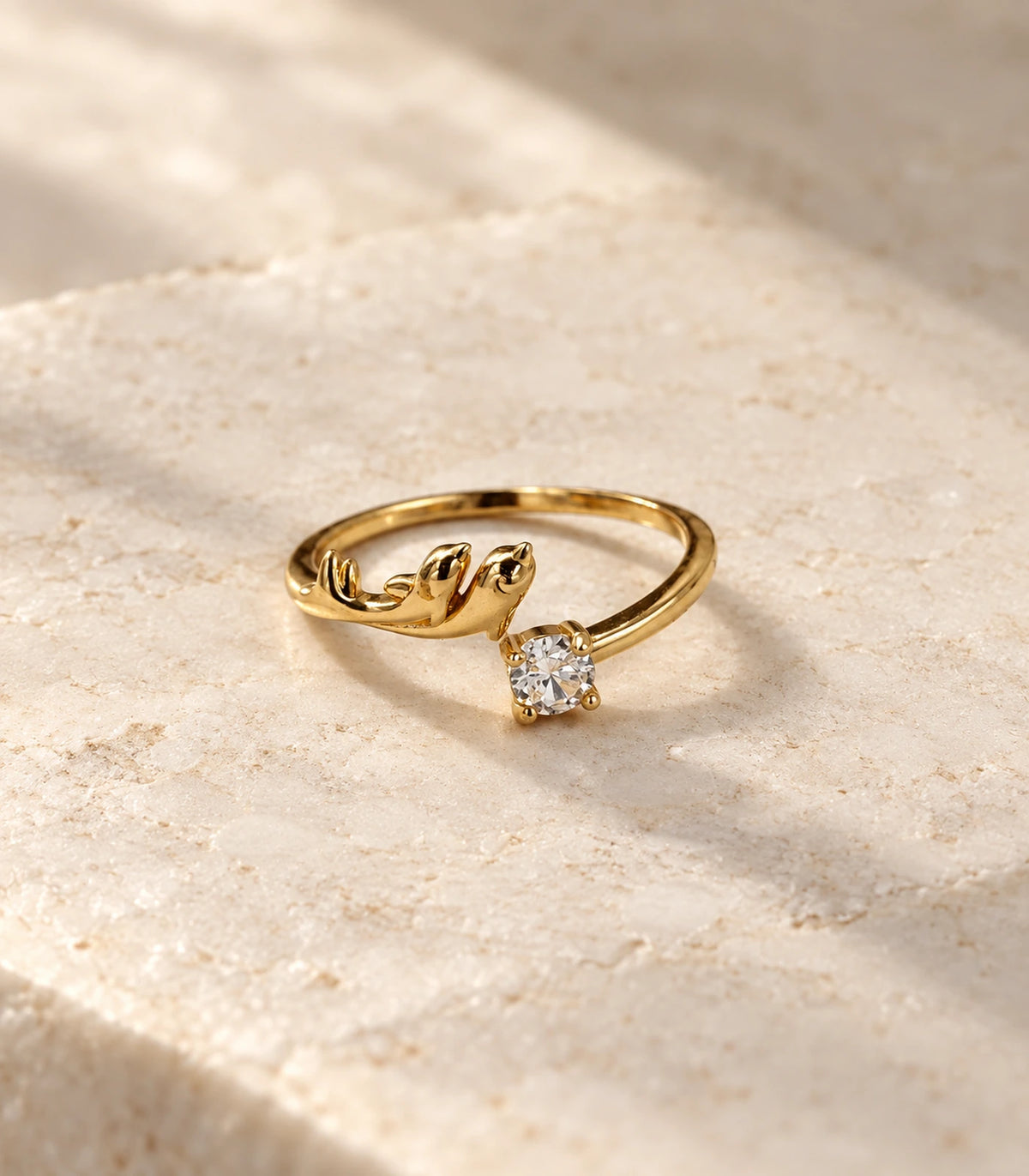 JIMIKI Gold Tone Round Crystal Sculptural Adjustable Ring in Gold Tone - editorial flatlay #color_gold-tone