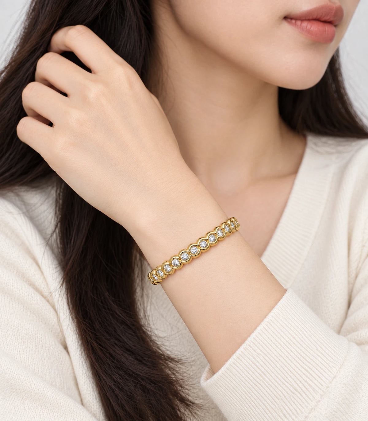 JIMIKI Gold-Tone Scalloped Bezel Crystal Bangle — worn on the wrist #color_gold-tone / clear