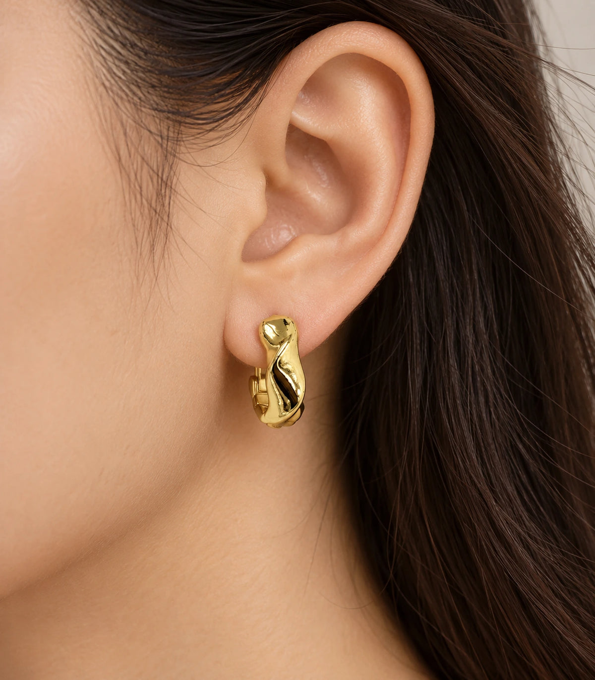 JIMIKI Gold Tone Sculpted Twist Hoop Earrings in Gold Tone - model #color_gold-tone