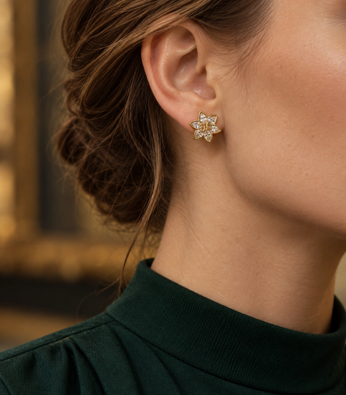JIMIKI Gold-Tone Six-Petal Crystal Flower Stud Earrings in Gold / Clear, editorial model view