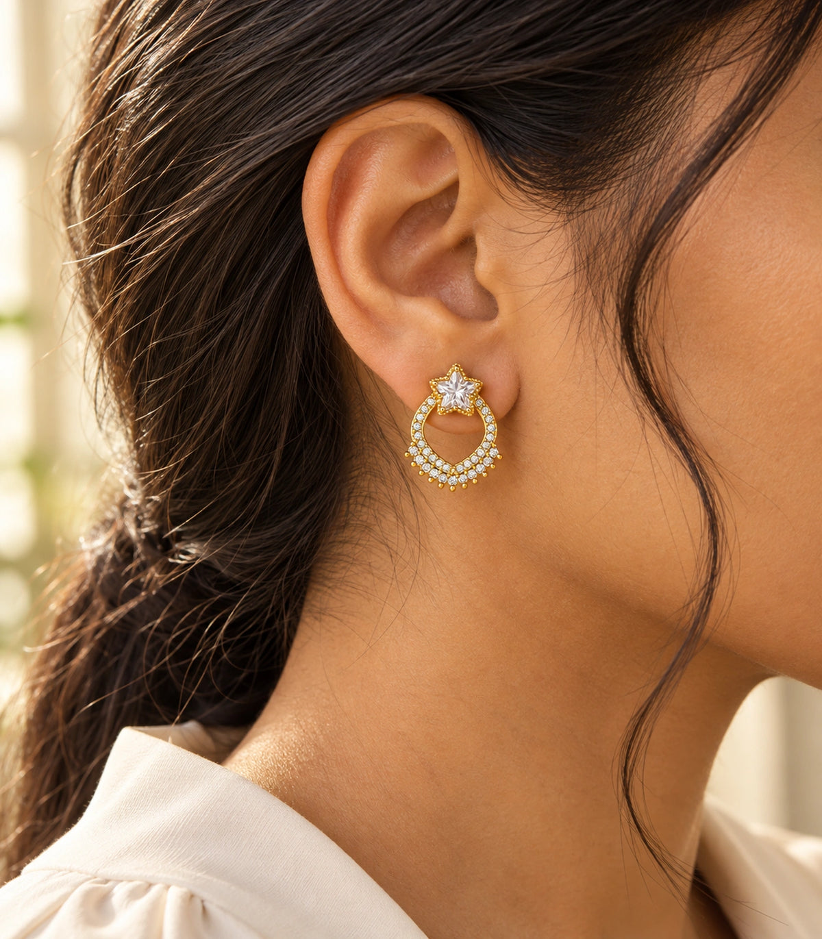 JIMIKI Star Crystal Open Loop Stud Earring Pair in Gold tone, editorial model view #color_gold tone