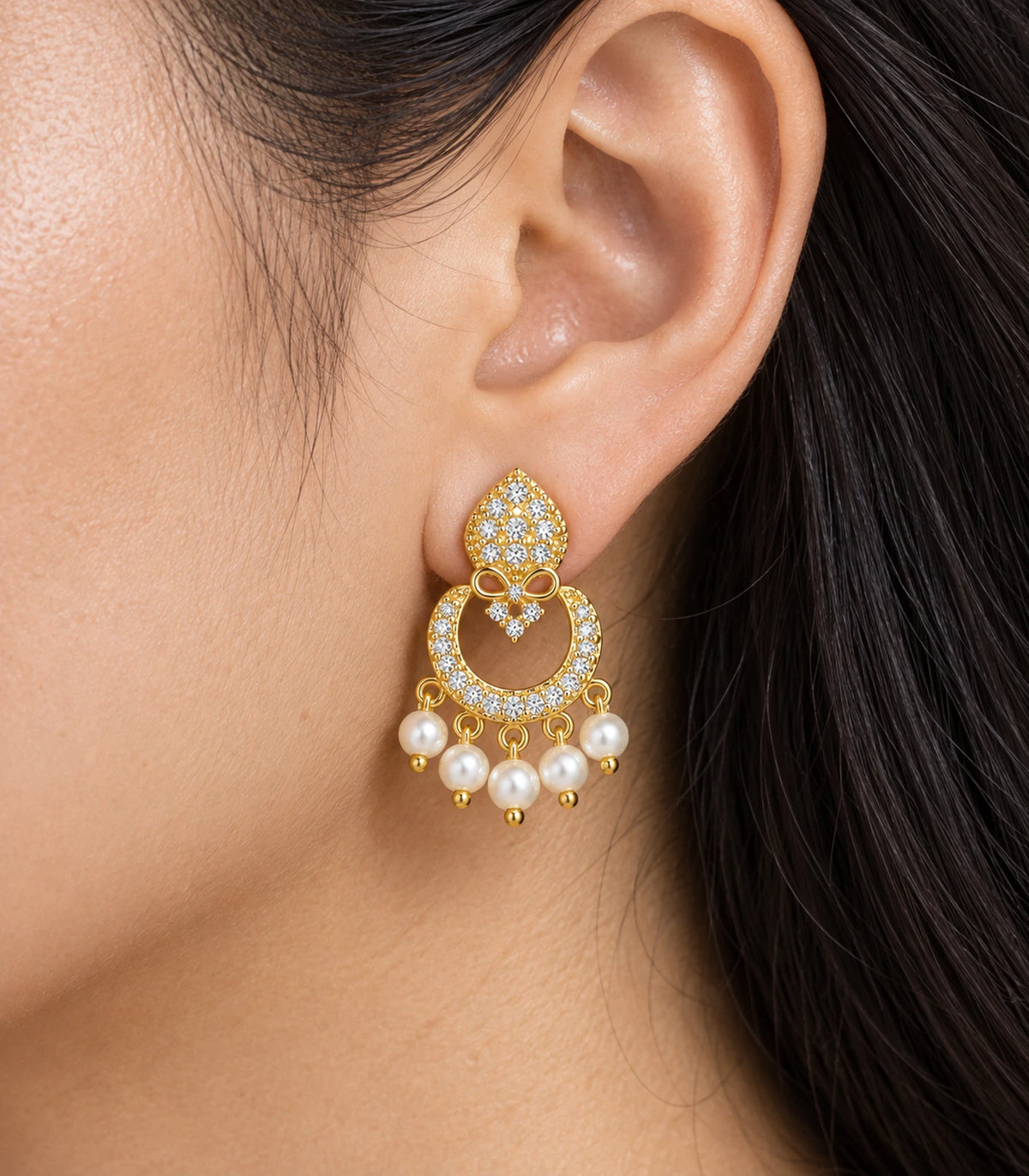 JIMIKI Gold-Tone Teardrop Bow Pearl Chandbali Earrings — close-up of the earring design #color_gold-tone / white
