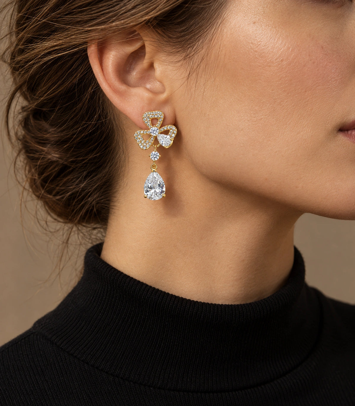 JIMIKI Gold-Tone Three-Loop Crystal Flower Pear Drop Earrings in Gold Tone, editorial model view
