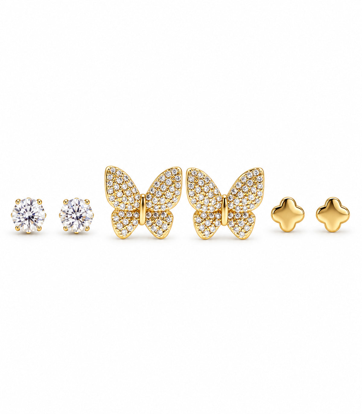 Complete gold-tone stud earring set: three pairs of clear round crystals, pavé butterflies and polished four-lobed flowers on white.