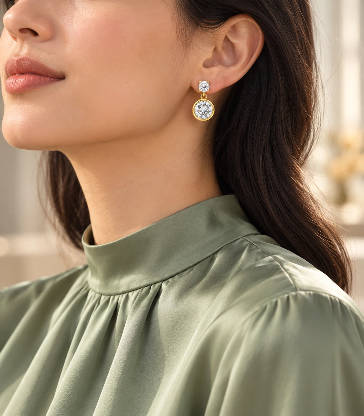 Linked round crystal drop earrings from the gold-tone three-pair set, styled view