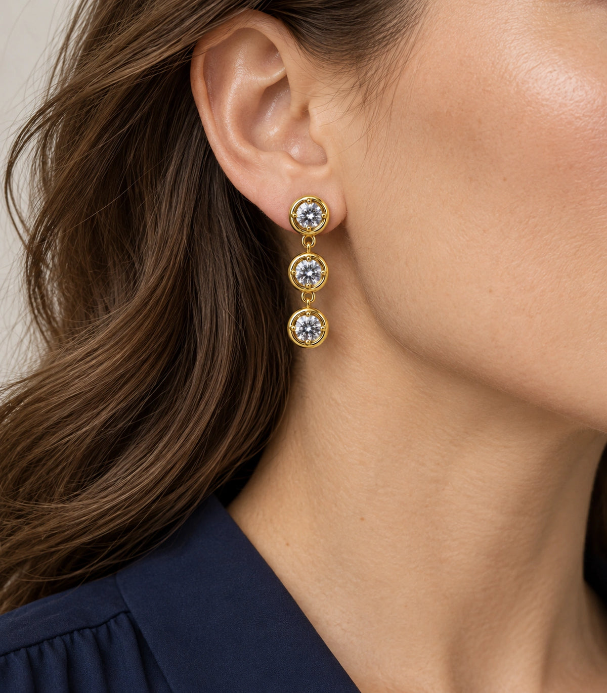 JIMIKI Three Round Crystal Drop Earring Pair in Gold tone/Clear, model wearing view #color_gold tone/clear