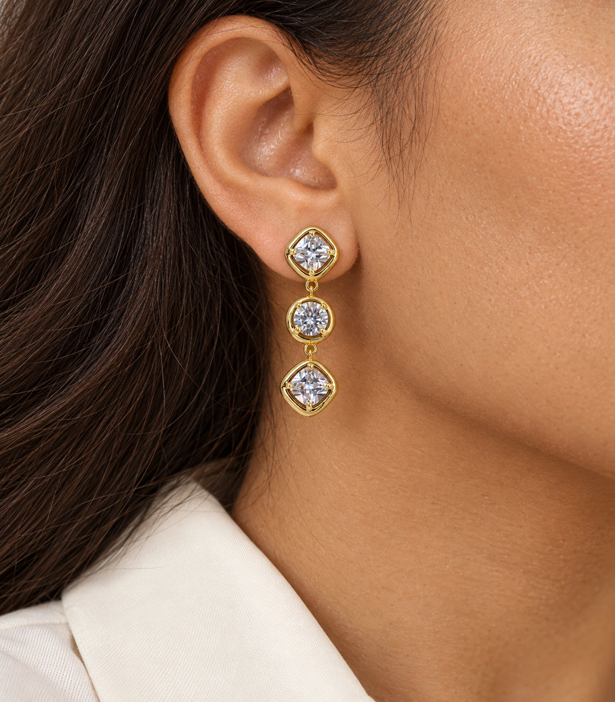 JIMIKI Three Stone Crystal Drop Earring Pair in Gold tone, close-up detail #color_gold tone