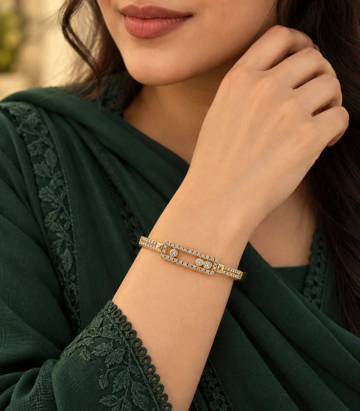JIMIKI Gold-Tone Three Stone Open Rectangle Bangle — bangle styled with an outfit #color_gold-tone / clear