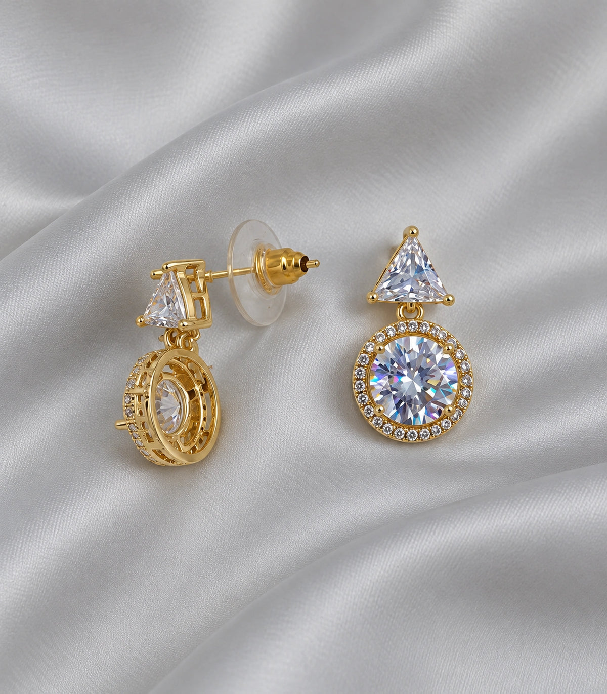 JIMIKI Triangle Round Halo Crystal Drop Earring Pair in Gold Tone, editorial flat lay #color_gold tone