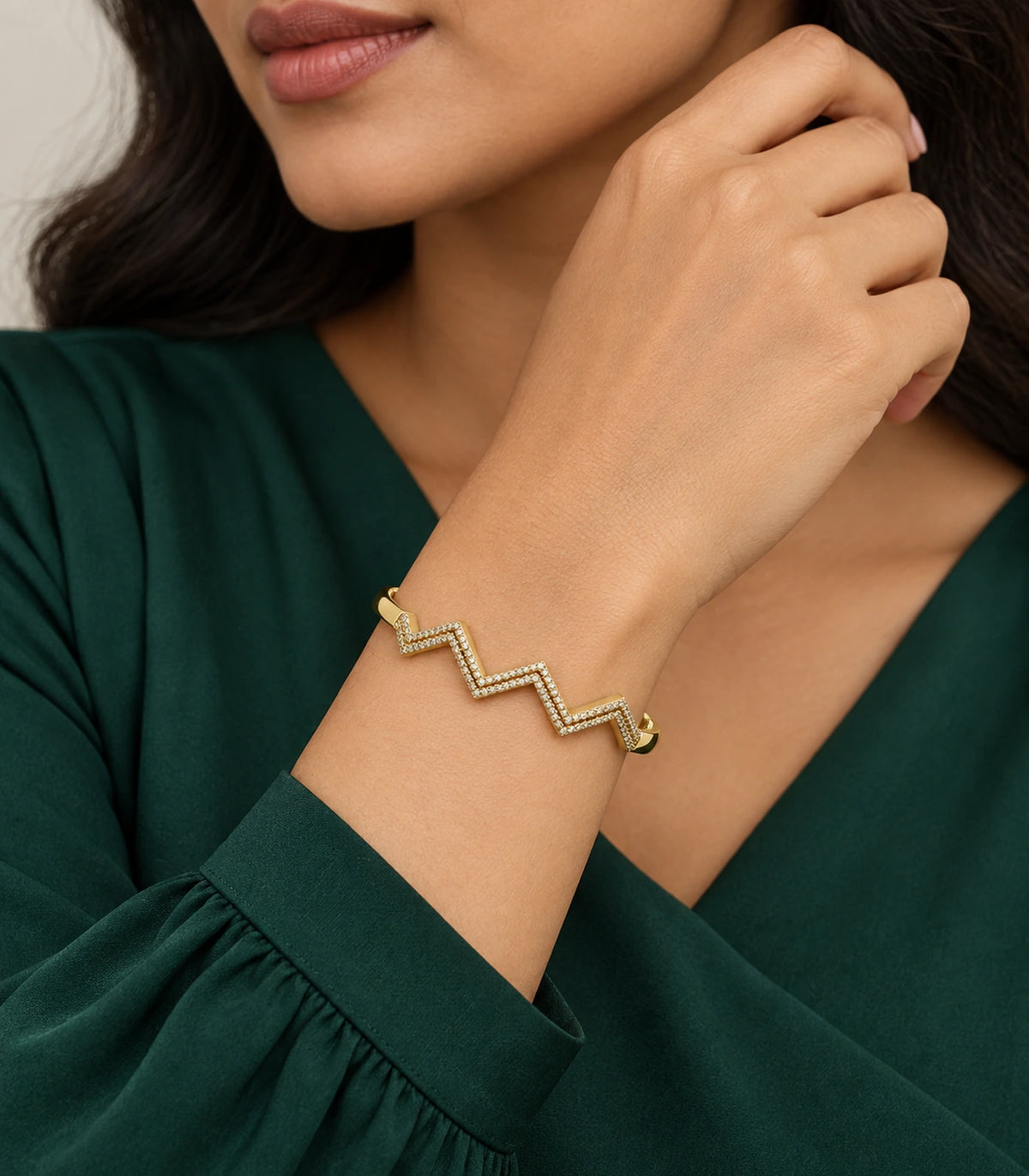 JIMIKI Gold-Tone Triple Chevron Pavé Bangle — worn on the wrist #color_gold-tone / clear